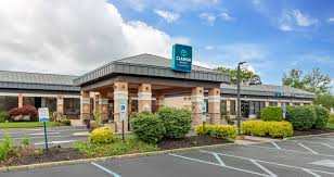Clarion Hotel and Conference Center exterior view, featuring a welcoming entrance and landscaped surroundings, relevant to upcoming events hosted at the venue by Fresh New Angle Events.