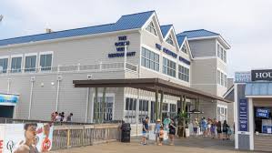 The Ocean View Restaurant exterior with people gathered outside, showcasing a coastal venue ideal for weddings and events.