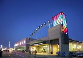 Wildwoods Convention Center exterior at night, featuring colorful illuminated signage and a modern architectural design, related to upcoming wedding expos and events hosted by Fresh New Angle Events.