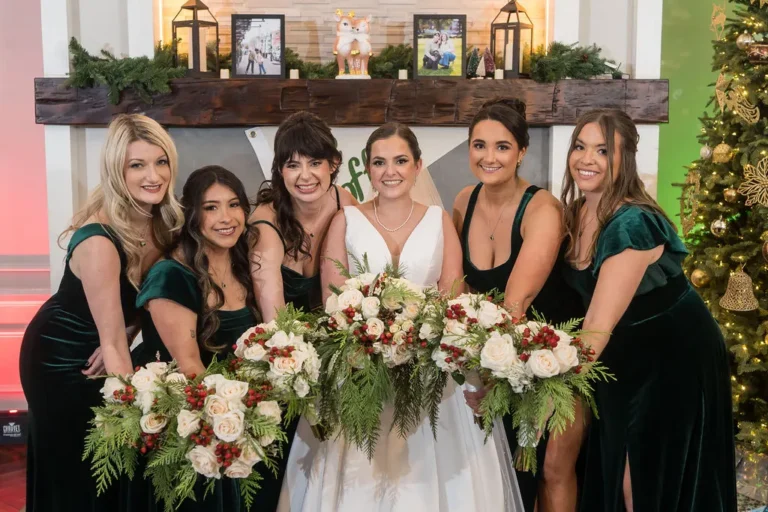 Maura with her bridesmaids in green velvet gowns