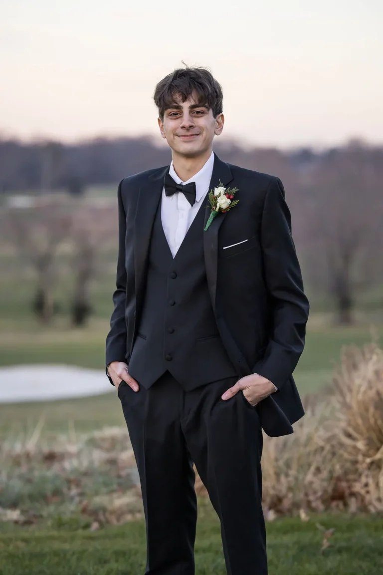 Christopher in his tuxedo on the Jumping Brook golf course