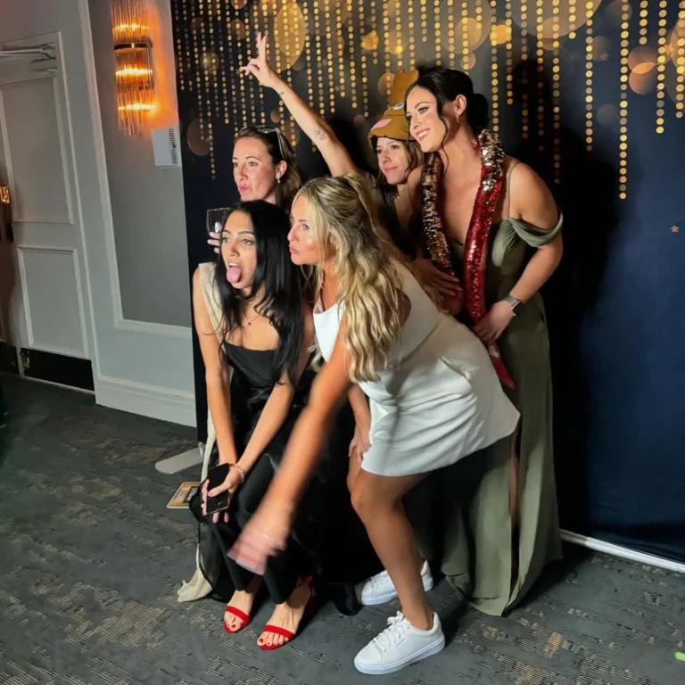 Wedding guests posing at an FNA Events photo booth