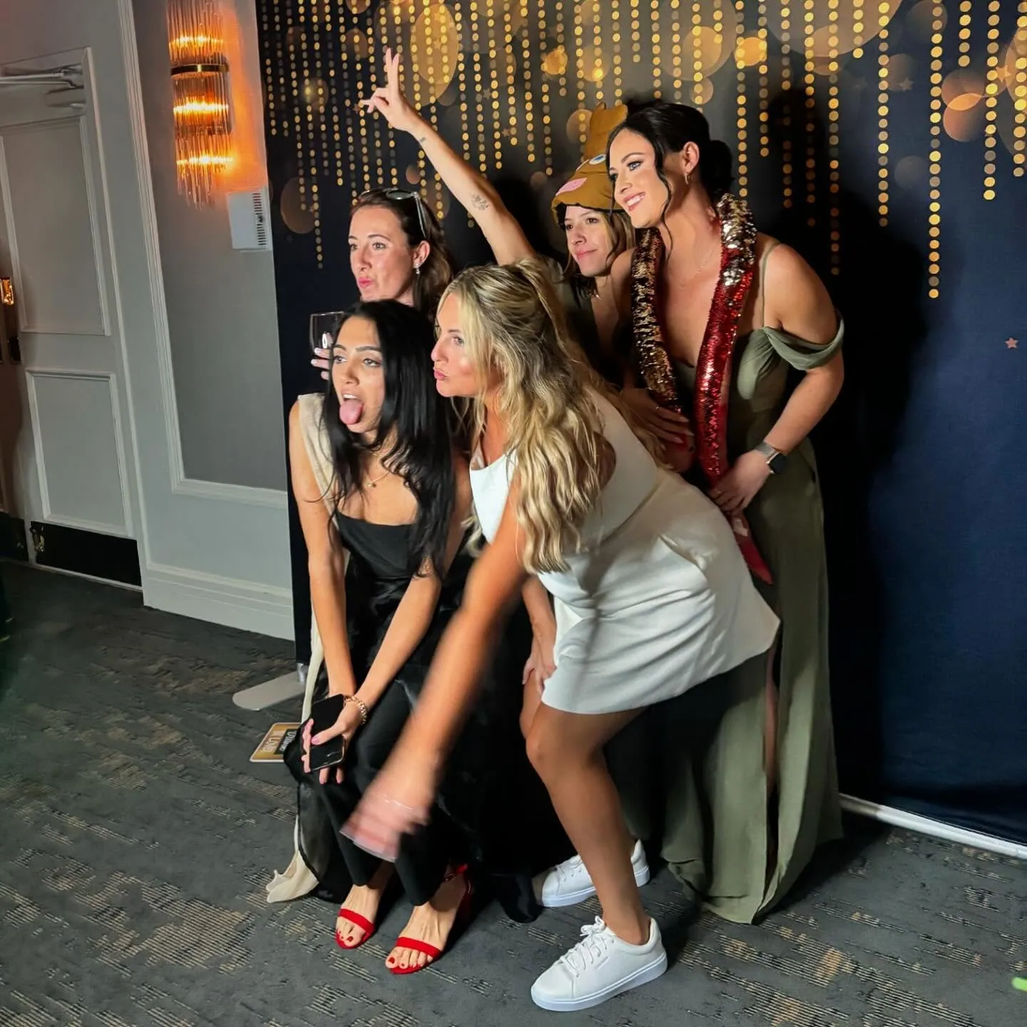 Students posing in an FNA Events photo booth