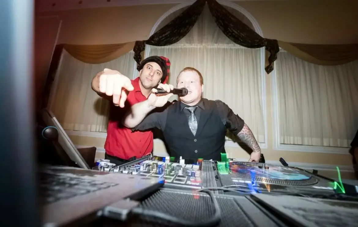 Two FNA entertainers performing at the DJ decks, Fresh New Angle Events