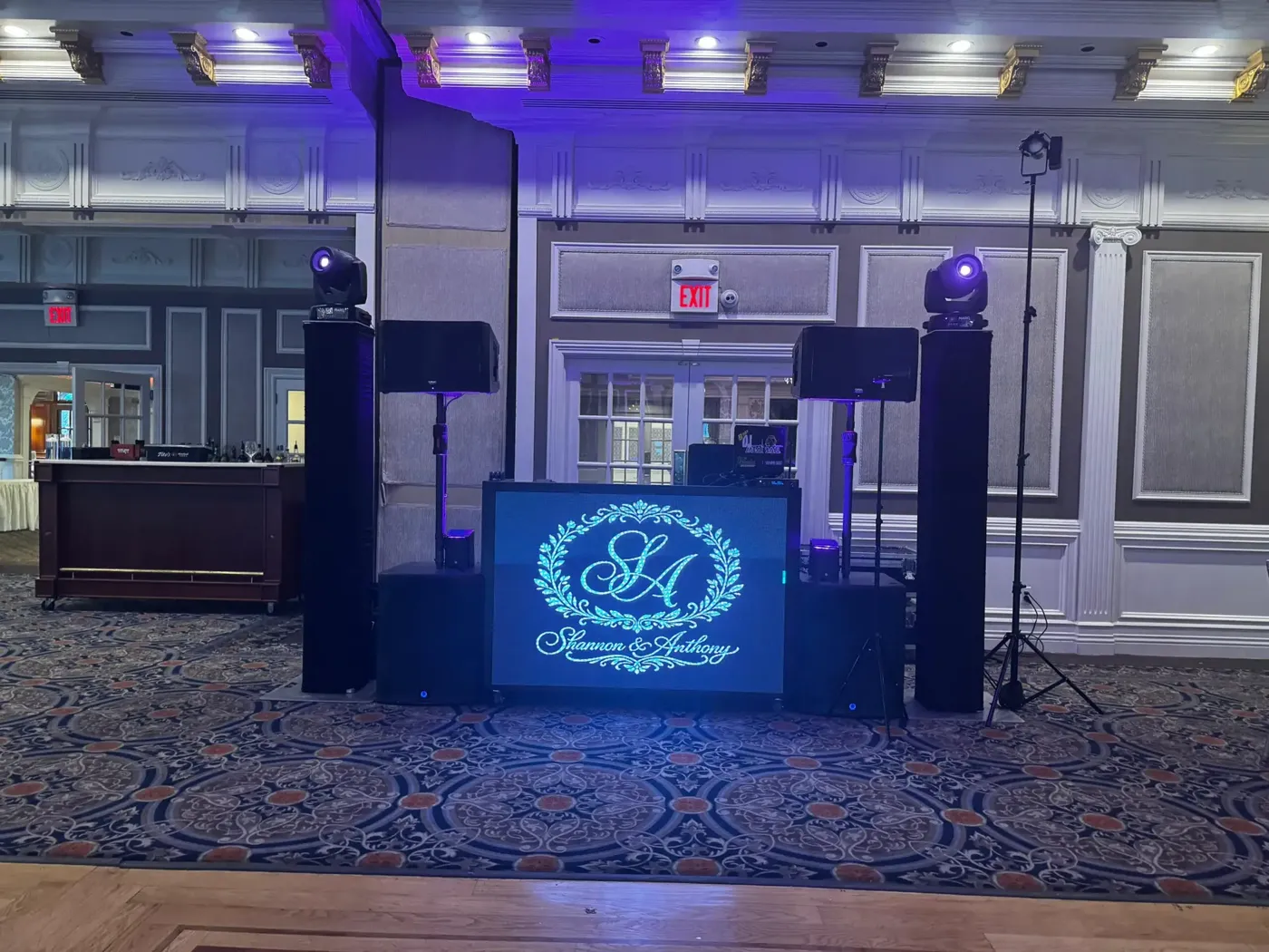 FNA DJ booth with a custom couple's monogram, Fresh New Angle Events