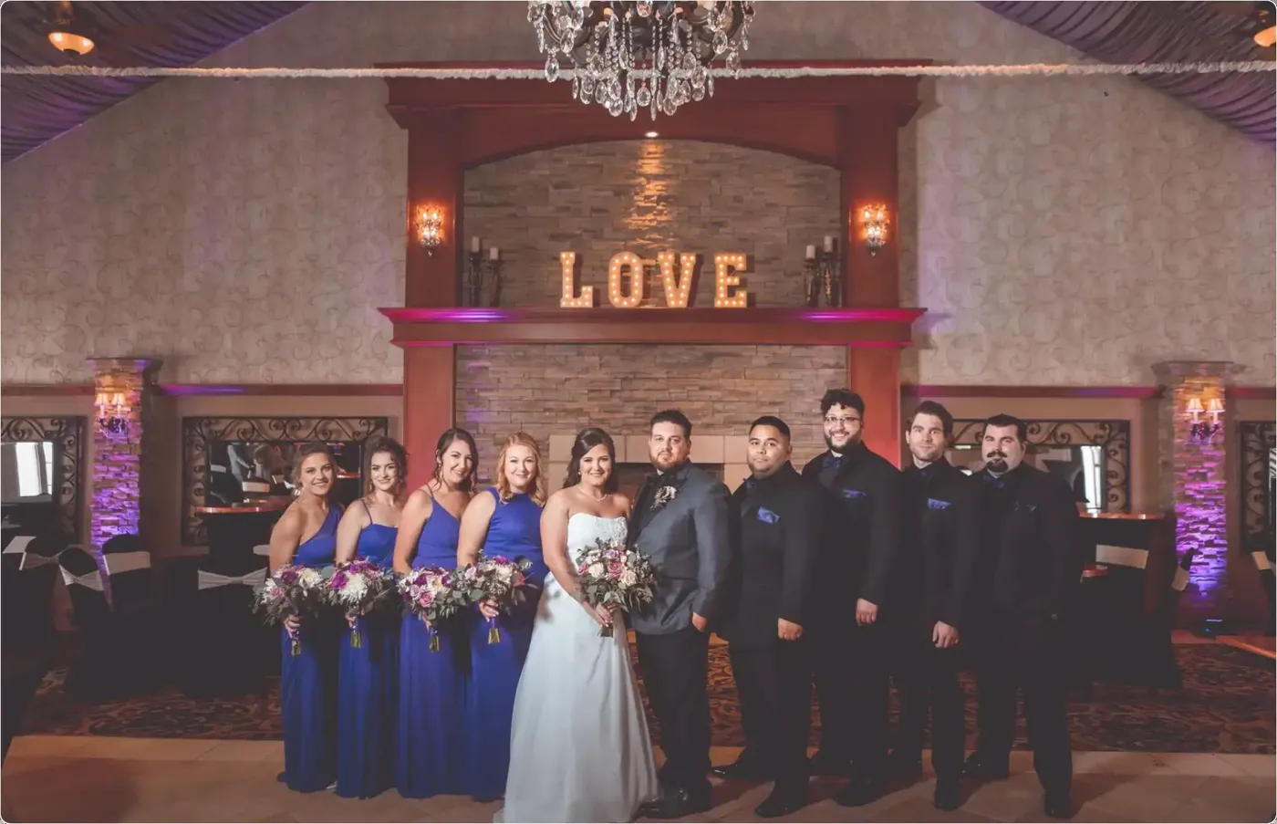 Wedding party in front of a custom LOVE monogram, Fresh New Angle Events
