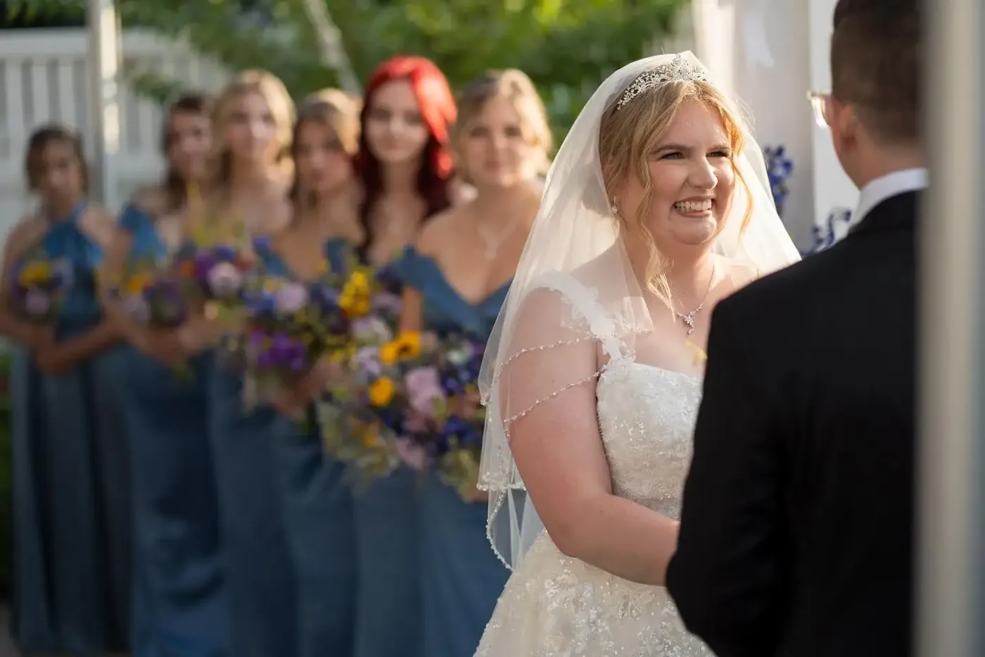 Bride smiling at her groom during an FNA-officiated ceremony, Fresh New Angle Events