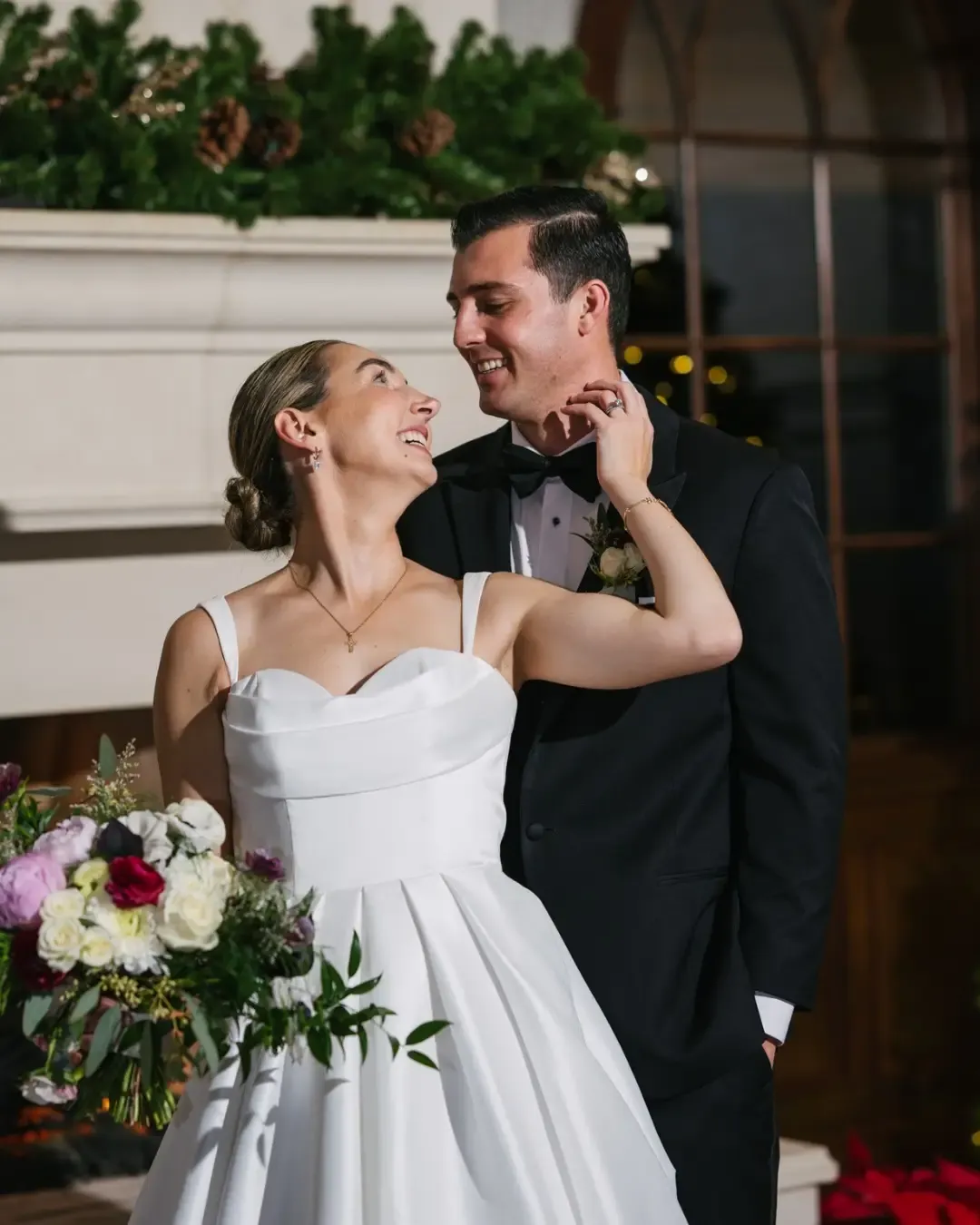 Bride and groom sharing a romantic moment beside a fireplace, Fresh New Angle Events